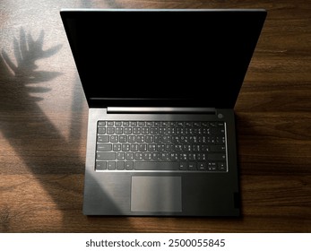 A laptop or portable computer opens its screen to prepare for work 