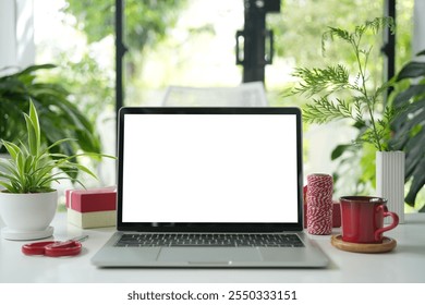 Laptop and red coffee cup with gift box and thread - Powered by Shutterstock