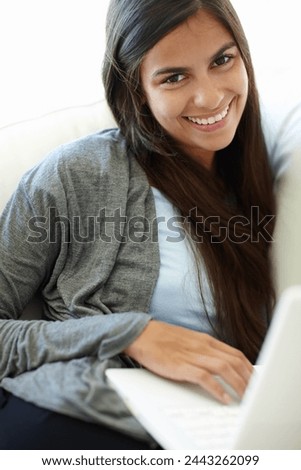 Laptop, relax and portrait of woman with smile, remote working and career of transcriber in house. Living room, employee and female person with happiness with internet online, comfort and couch