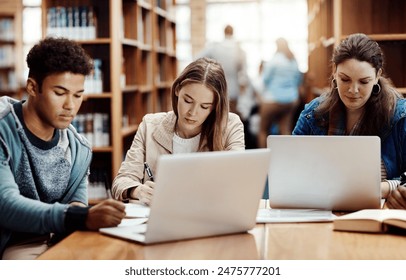 Laptop, research and students learning at college library for education, knowledge or test preparation. University friends, man and studying on computer for help, project notes and online report - Powered by Shutterstock