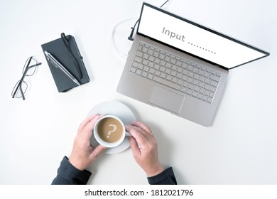 Laptop Screen Asking For Input And Hands Of An Elderly Woman Are Holding A Coffee Cup With A Question Mark, Concept For Challenges Of Older People To Operate With Modern Technology
Top View From Above