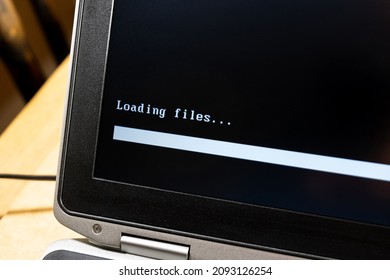 Laptop screen, computer display closeup, loading files progress bar, waiting for digital data to load, installation concept, nobody. Patience, slow process, computing and processing abstract concept
