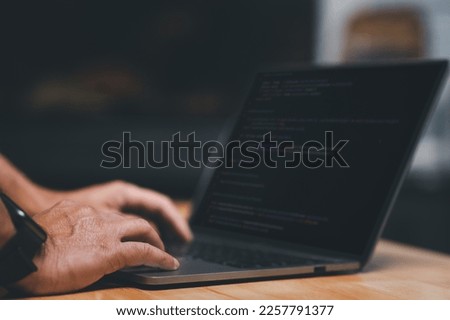 Laptop screen display blur script code, compiler, encode, debug, developer application software for business corporate with laptop computer. Instruction set of programming coding app from work at home