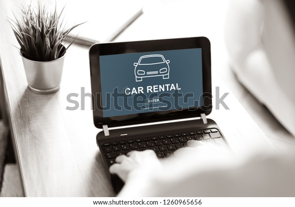 Laptop screen\
displaying a car rental\
concept