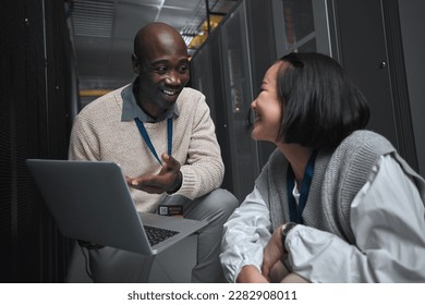 Laptop, server room or technician people for teamwork, problem solving or database management system upgrade. Cybersecurity, data center or engineer employees for information technology or programmer