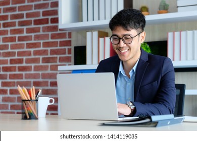 Laptop And Smiling Asia Man, Young Happy Asian Businessman Working With Laptop Computer At Office Background, , Business Office Lifestyle Concept