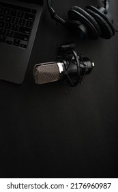 Laptop, Studio Microphone And Studio Headphones On A Gray Background. There Are No People In The Photo. There Is Free Space To Insert. Blogging, Audio, Podcast, Radio.