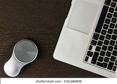 Laptop And Stylish Mouse On Table