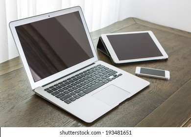 Laptop With Tablet And Smart Phone On Table