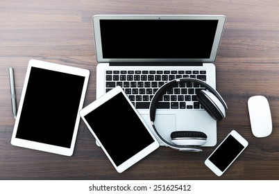 Laptop With Tablet And Smart Phone On Table