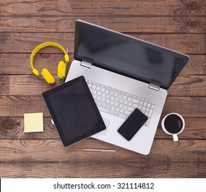 Laptop With Tablet And Smart Phone On Table