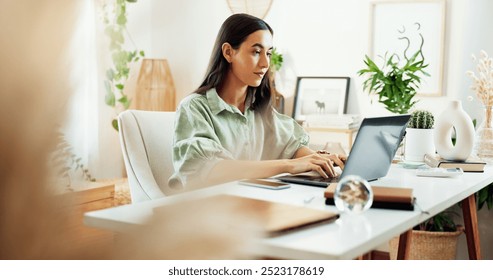 Laptop, typing and woman at desk in home office with growth, development and planning for freelance project. Remote work, connectivity and writer with computer for online research, review or article