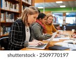 Laptop, typing and woman in library for study group with university, education and scholarship application. Books, online research and college student on campus with learning, knowledge and growth