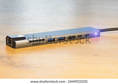 Laptop USB Type-C adapter with different connectors for connecting devices.