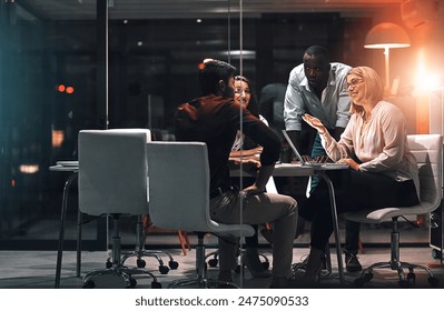 Laptop, window and business people with meeting at night for brainstorming, research or project plan. Creative team, developer and discussion with tech for software development, overtime or ux review - Powered by Shutterstock