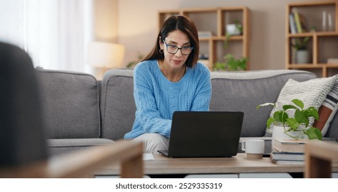 Laptop, working and woman in home with freelancer, writer and editor for website. Living room, sofa and planning digital article and post with technology and reading for story research in morning