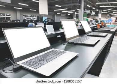 Laptops In A Modern Technology Store. Department Of Computers In The Electronics Store. Choosing A Laptop In The Store