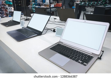 Laptops In A Modern Technology Store. Department Of Computers In The Electronics Store. Choosing A Laptop In The Store