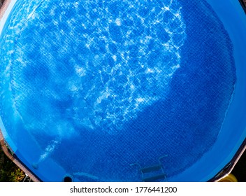 Large Above Ground Metal Frame Swimming Pool Top View Of Water Surface. Summer Theme