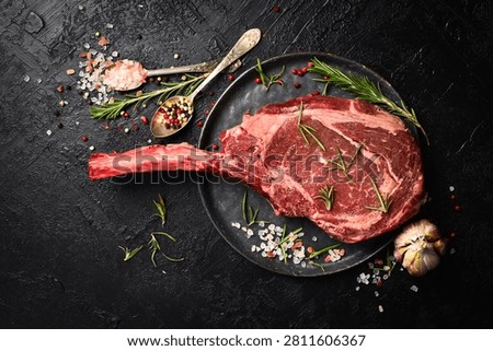 Large aged beef steak on the bone. Premium raw Tomahawk steak. Top view.