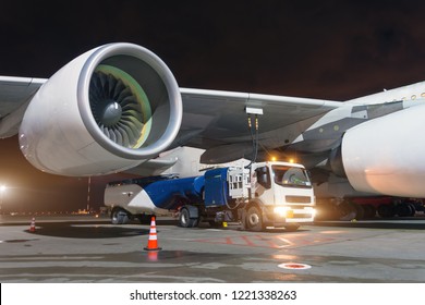 Large Aircraft Jet Engines, Fueling A Huge Airplane, A Truck With Fuel With Hoses Connected To A Fuel Tank