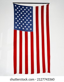 Large American Flag Hanging On Wall