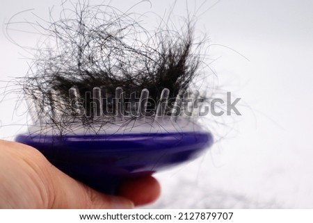 A large amount of hair loss on the hairbrush