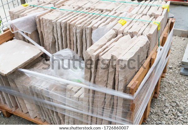 Large amount\
of stone tiles for paving the\
garden