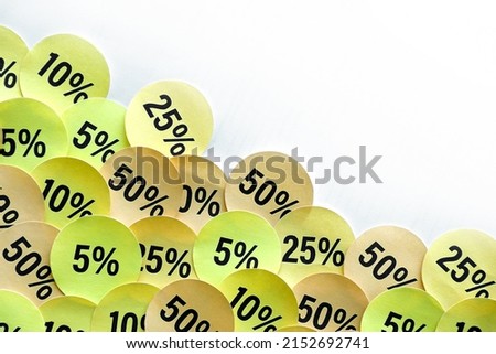 Large amount of yellow stickers with percentage values for black friday or cyber monday sale. Abstract image of discount prices for any goods