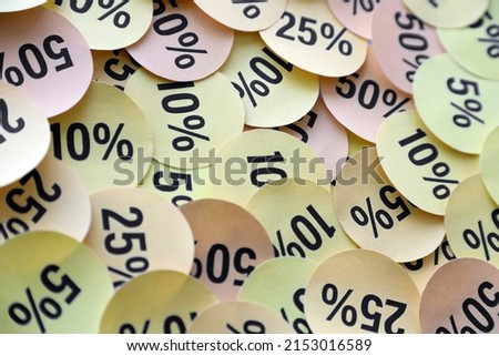 Large amount of yellow stickers with percentage values for black friday or cyber monday sale. Abstract image of discount prices for any goods