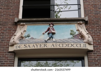 large Amsterdam facade sculpture of canal house, depicting sower, with text: "the sower - anno 1652" - Shutterstock ID 2163537499