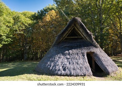 
A large ancient pit dwelling in modern nature - Shutterstock ID 2224339931