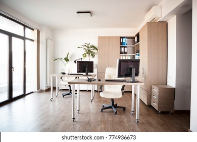 Large Angle View. Interior Of An Empty Modern Office With An Empty Desk. Business And Workplace. Clean Interior Of A Corporate Company