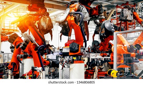 Large automated robotic arm in a car manufacturing plant