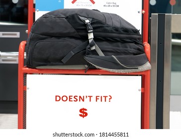 A Large Backpack Lying On A Control Cage For Measure Size Of Carry On Luggage. Checking Baggage Size At The Airport.