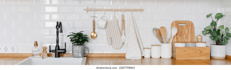 Large banner View of white modern country style kitchen interior with hanging storage, eco friendly food storage. Zero waste home concept - Powered by Shutterstock