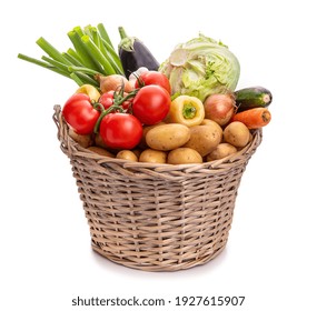 Large basket of vegetables. Potatoes, tomatoes, onions, cabbage, paprika, zucchini, eggplant. Isolate on white background - Powered by Shutterstock