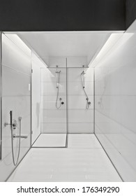 Large Bathtub And Glass Shower Cubicle In A Modern Bathroom