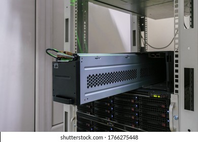 Large Battery Close-up. Changing The Power Module In The Server Room Close-up. Working With Equipment In The Datacenter Rack