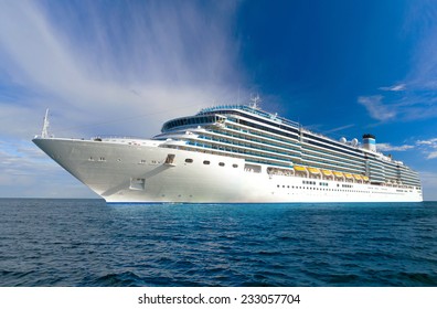 Large Beautiful Cruise Ship At Sea And Nice Cloudy Sky On Background