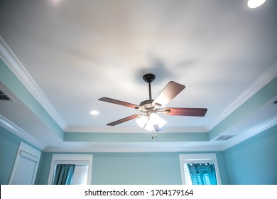 Large Bedroom With Intricate And Detailed Tray Ceiling With Large Double Moulding Trim, Can Lights And A Ceiling Fan