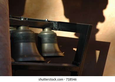 Large Bells In A Carillon Late Illuminated By The Late Afternoon Sun.