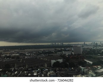 Large black clouds hovering over the city