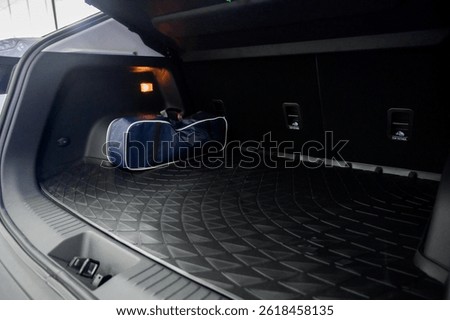 Large black empty car trunk. Open car trunk close up. Empty open trunk of a new modern car