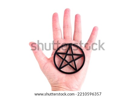 Large black five-point star with a circle around in hand isolated on white background.