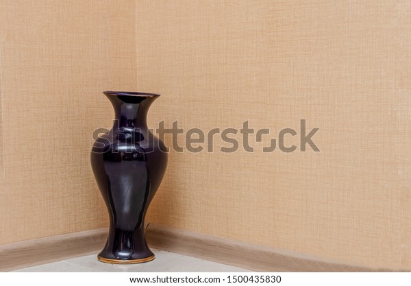 Large Black Vase Stands On Floor Royalty Free Stock Image