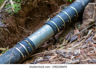 Large Black Water Hose It Was Connected By A Steel Pipe And Used To Scrub The Steel Band Around. Water Pipes That Connect From Natural Weirs In The Forest For Community Use