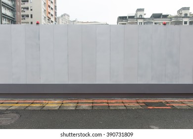 Large blank billboard on a street wall, banners with room to add your own text - Shutterstock ID 390731809
