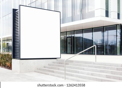 Large Blank Outdoor Billboard Template With White Copy Space To Add Multiple Company Names And Logos With Modern Office Building In Background