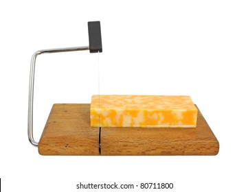 A Large Block Of Reduced Fat Colby Jack Cheese On A Cheese Cutting Board.